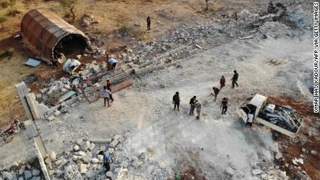 TOPSHOT - An aerial view taken on October 27, 2019 shows the site that was hit by helicopter gunfire which reportedly killed nine people near the northwestern Syrian village of Barisha in the Idlib province along the border with Turkey, where "groups linked to the Islamic State (IS) group" were present, according to a Britain-based war monitor with sources inside Syria. - The helicopters targeted a home and a car on the outskirts of Barisha, the Syrian Observatory for Human Rights said, after US media said IS leader Abu Bakr al-Baghdadi was believed to be dead following a US military raid in the same province. Observatory chief Rami Abdel Rahman said the helicopters likely belonged to the US-led military coalition that has been fighting the extremist group in Syria. (Photo by Omar HAJ KADOUR / AFP) (Photo by OMAR HAJ KADOUR/AFP via Getty Images)