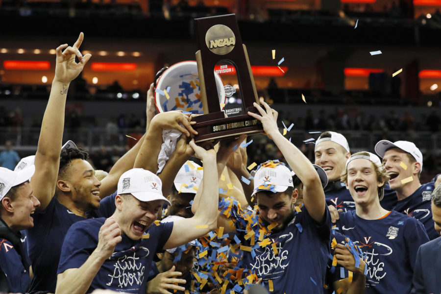 LOUISVILLE, KENTUCKY - MARCH 30:  The Virginia Cavaliers raise the trophy after defeating the Purdue Boilermakers 80-75 in overtime of the 2019 NCAA Mens Basketball Tournament South Regional to advance to the Final Four at KFC YUM! Center on March 30, 2019 in Louisville, Kentucky. (Photo by Kevin C.  Cox/Getty Images)
